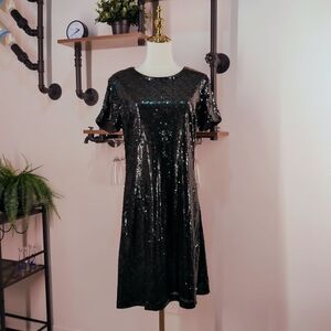 Scintillating GUESS Los Angeles Sequin Mini Dress in Black. Perfect for Holiday
